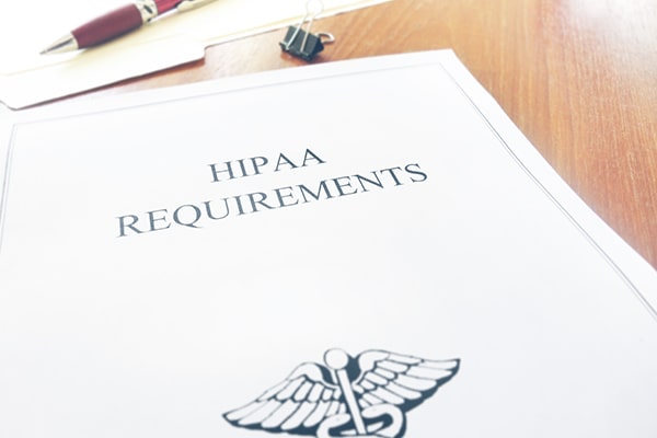 Closeup of HIPAA requirements documents on a desk