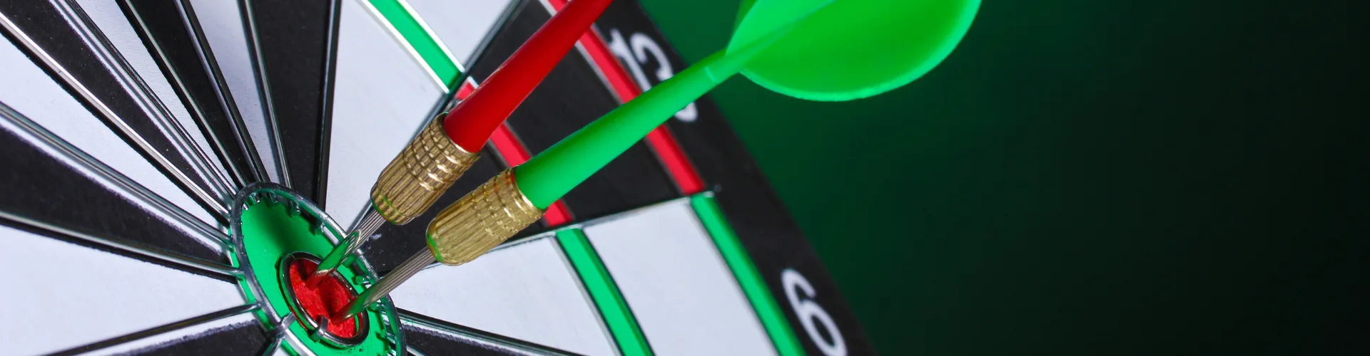 dartboard with red and green darts